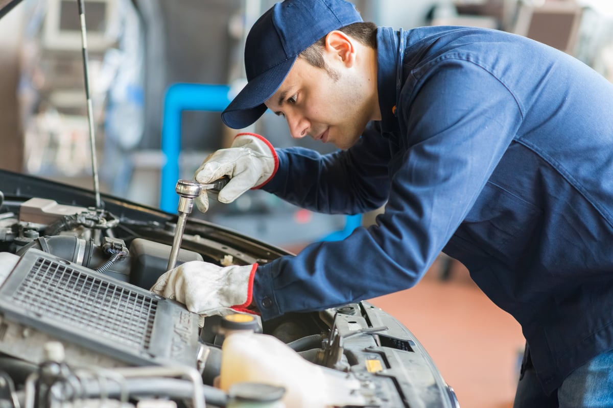 Mechanic working on a truck in the garage