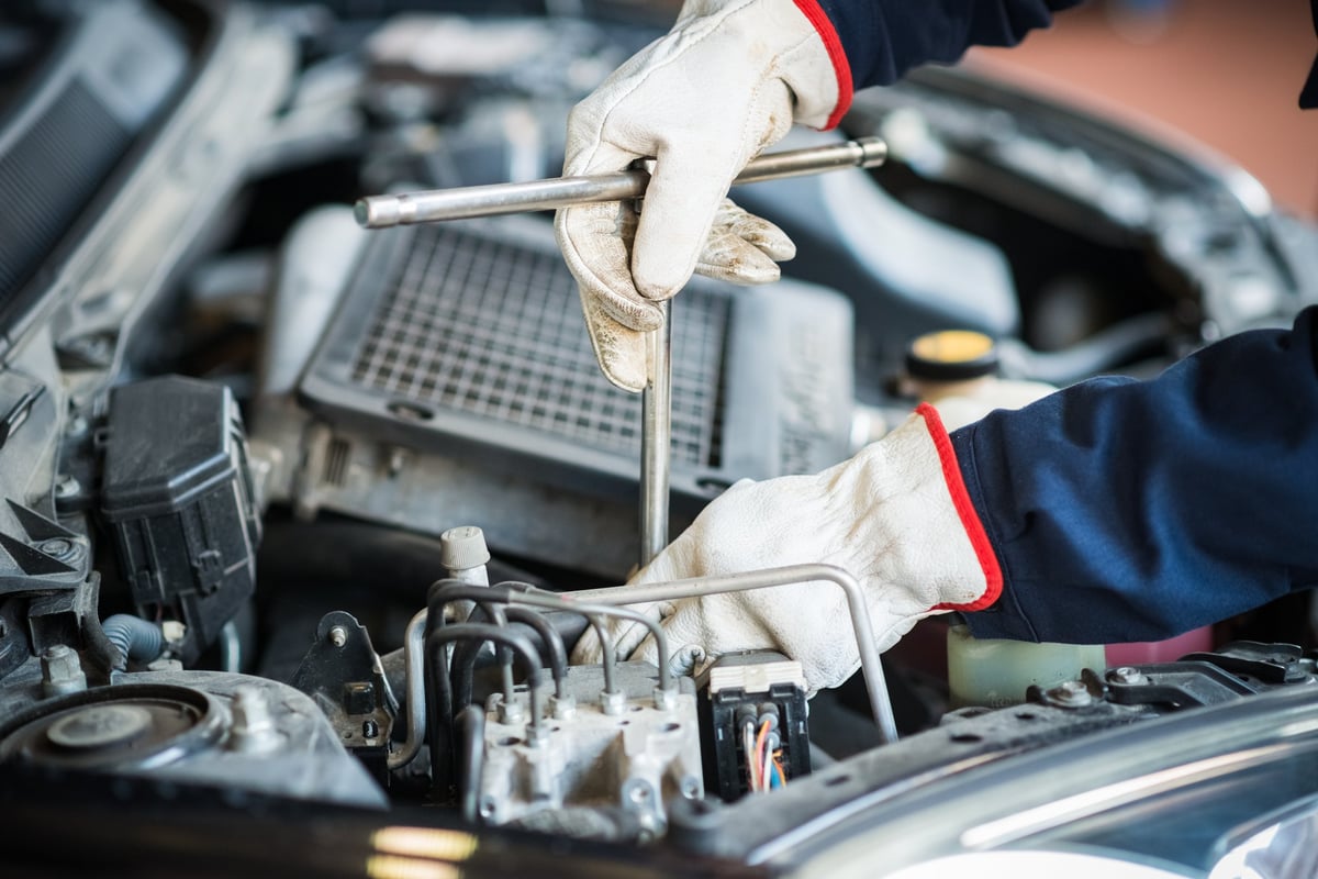Mechanic working on a truck engine